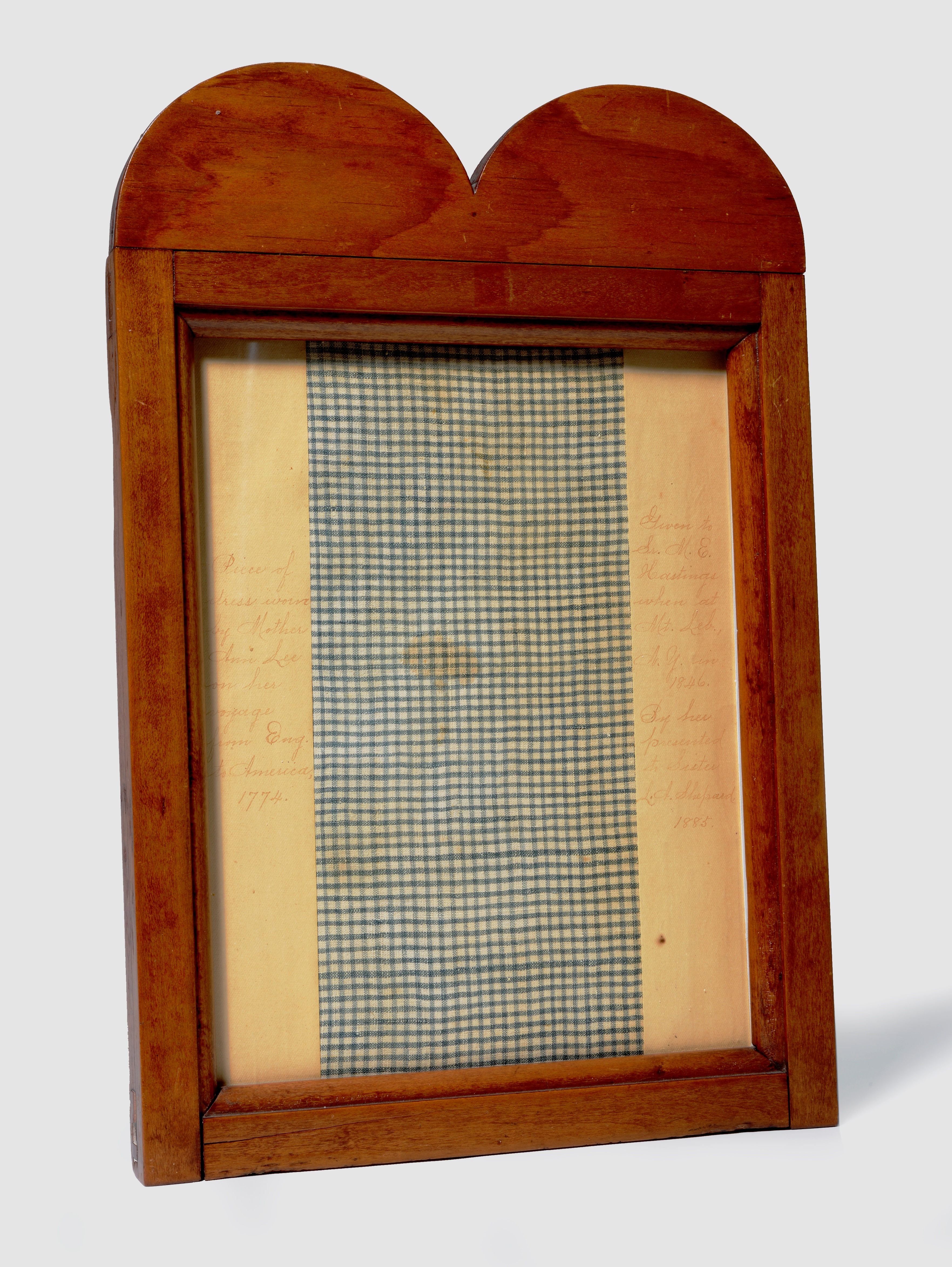 A wooden frame with a piece of paper in it.