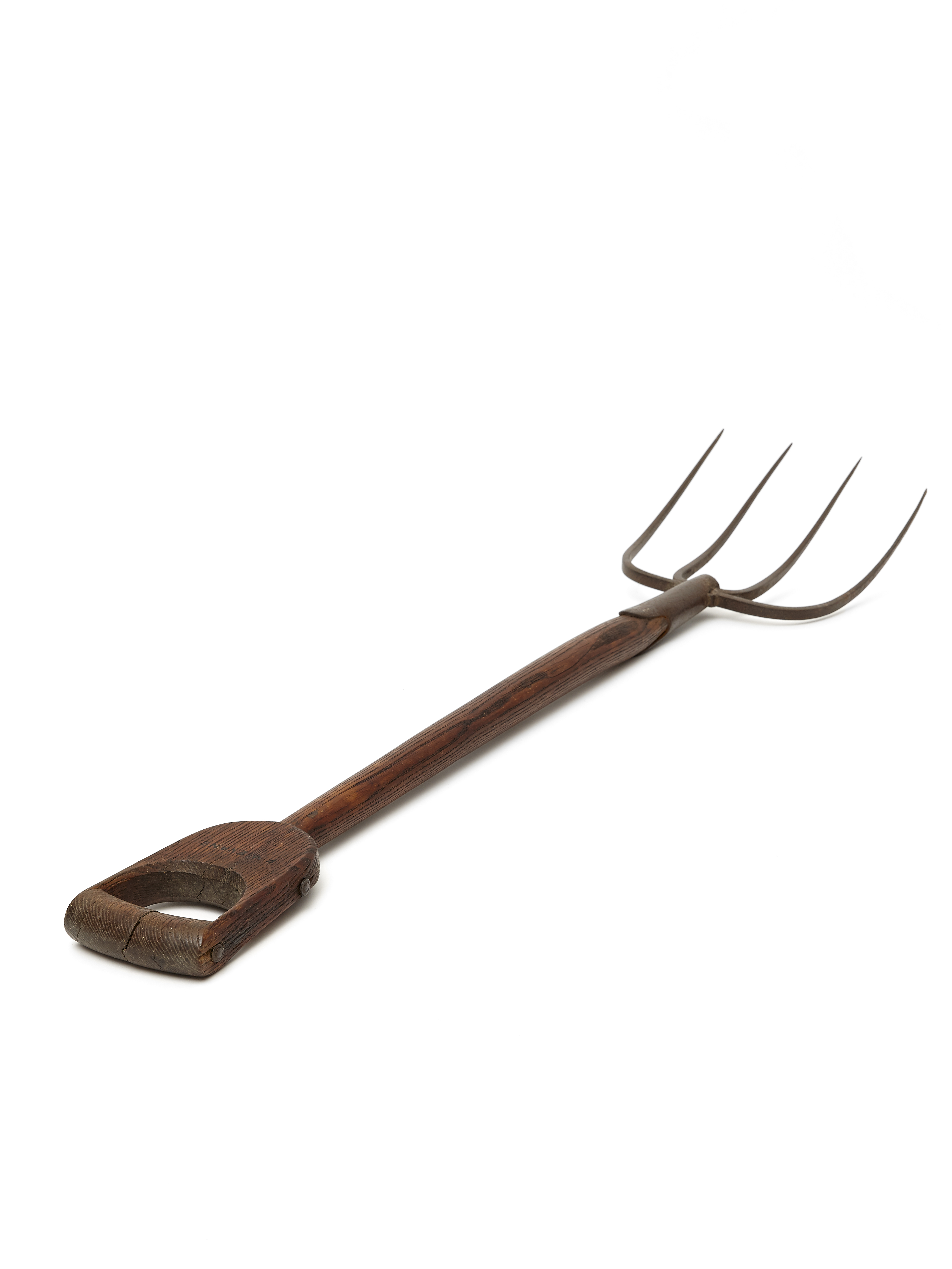 A wooden pitchfork on a white background.