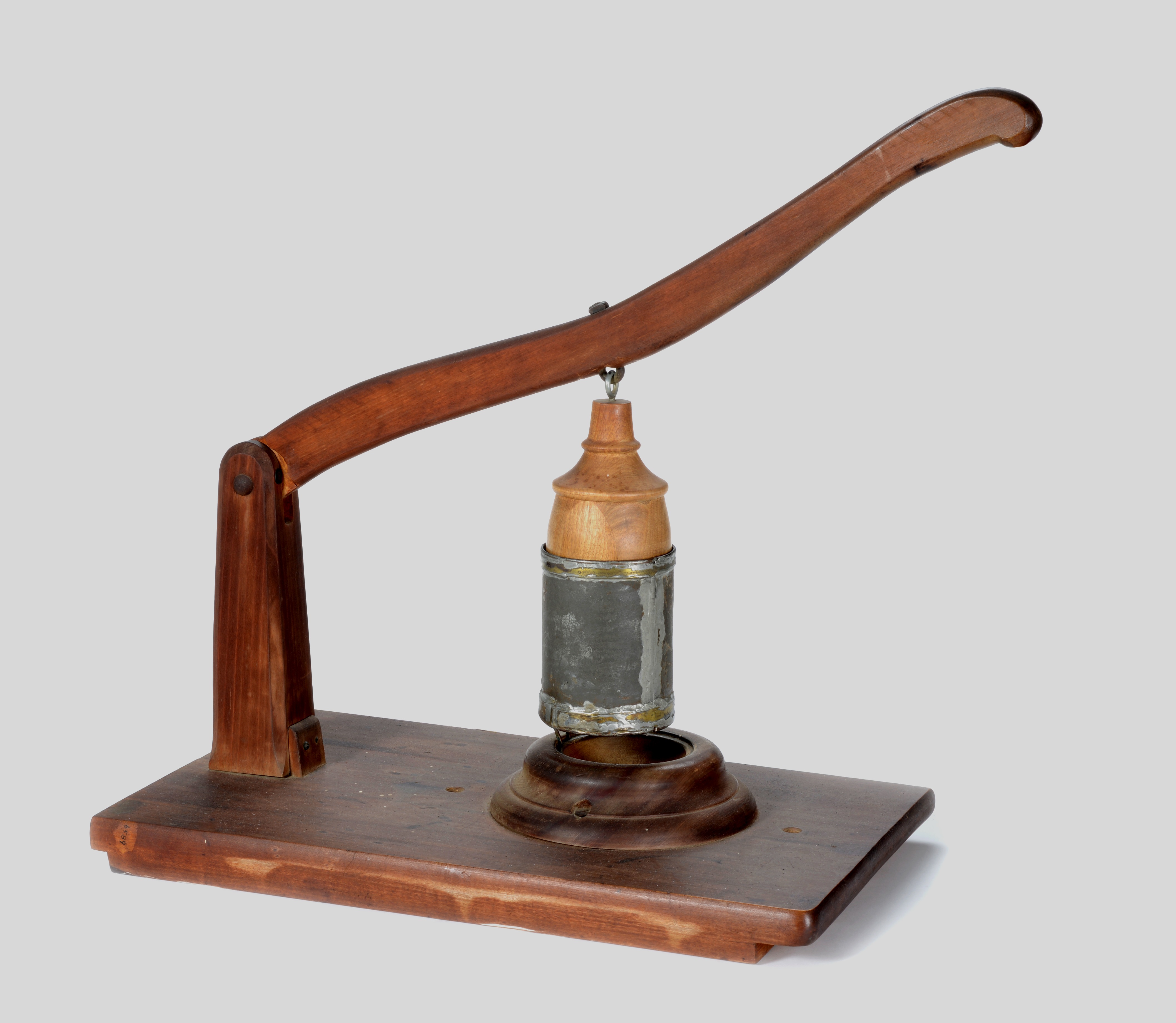 A wooden stand with a bottle on it.