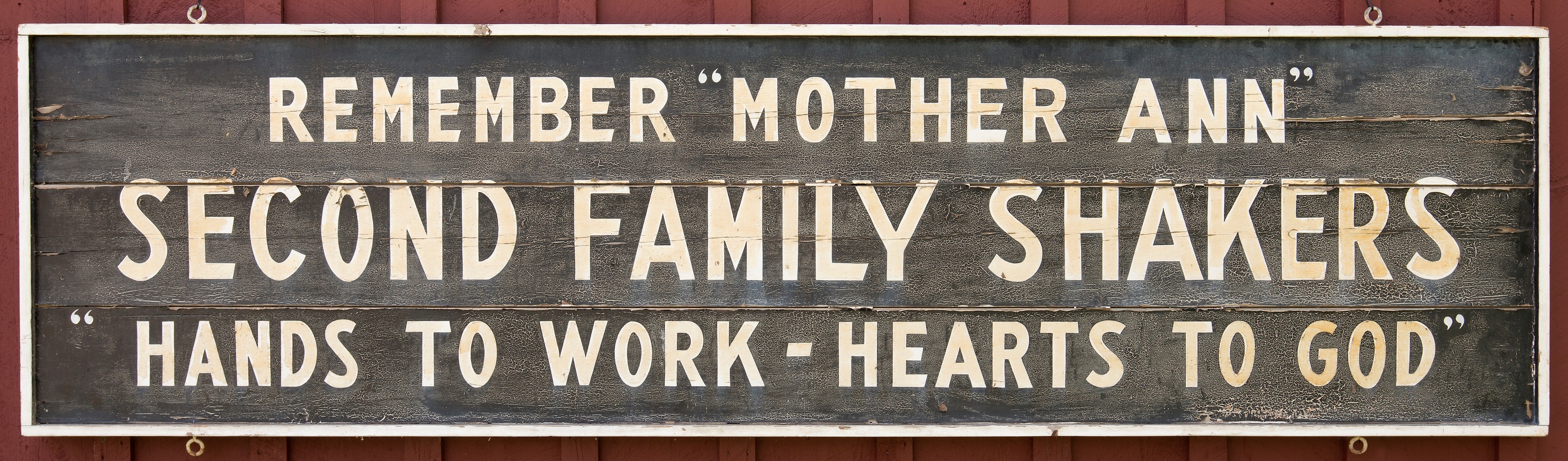 A sign that says remember mother an second family shaker hands work hearts to god.