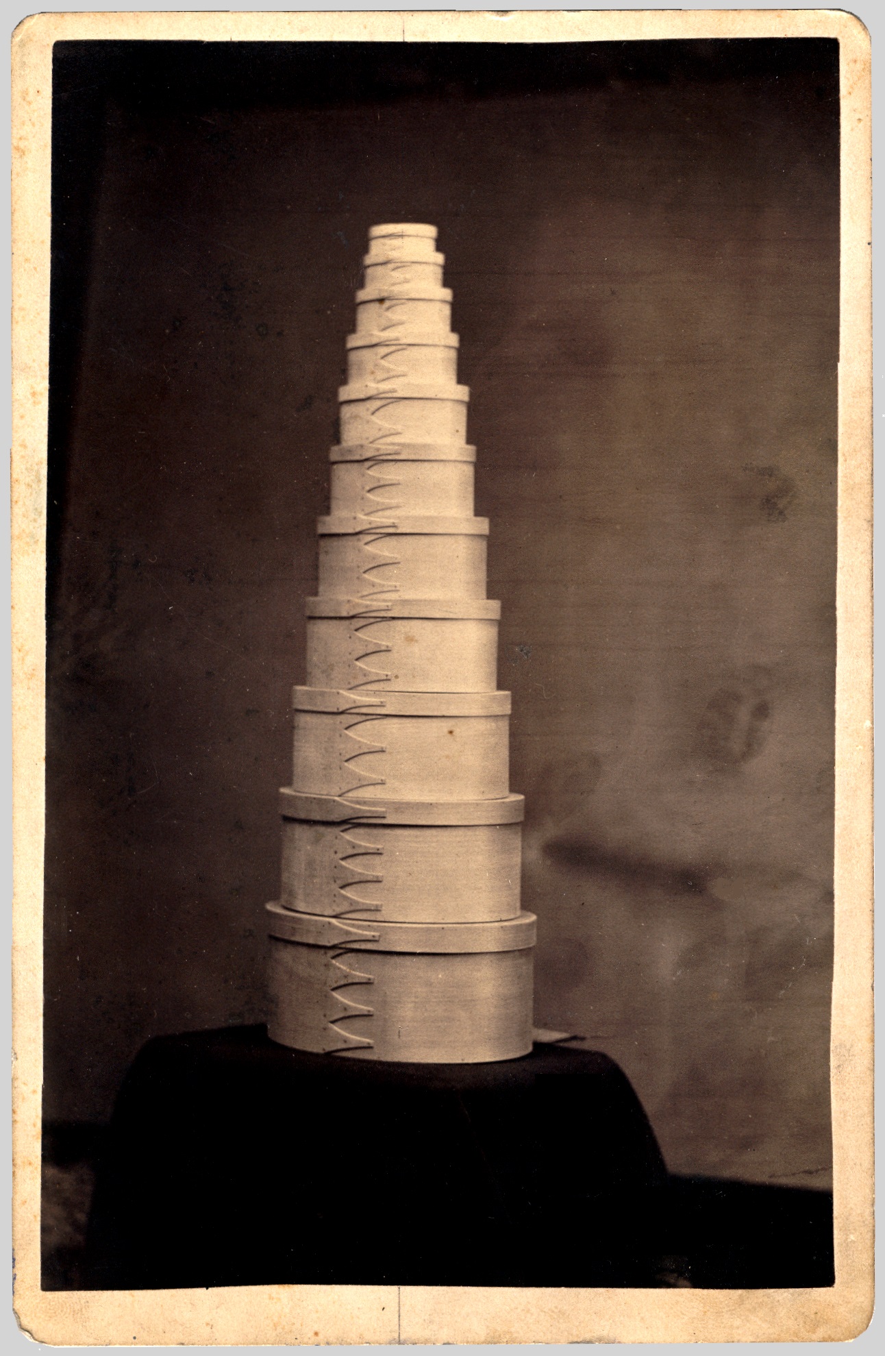 A stack of white boxes on top of a black background.