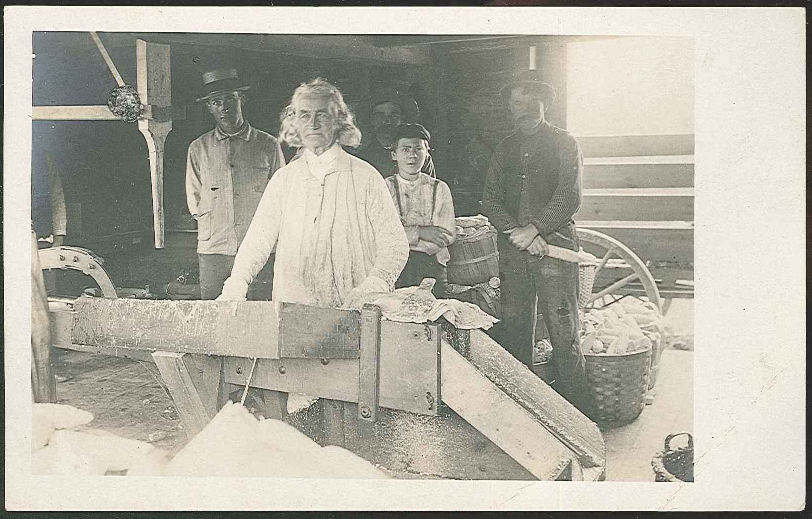 A woman standing in front of a machine.