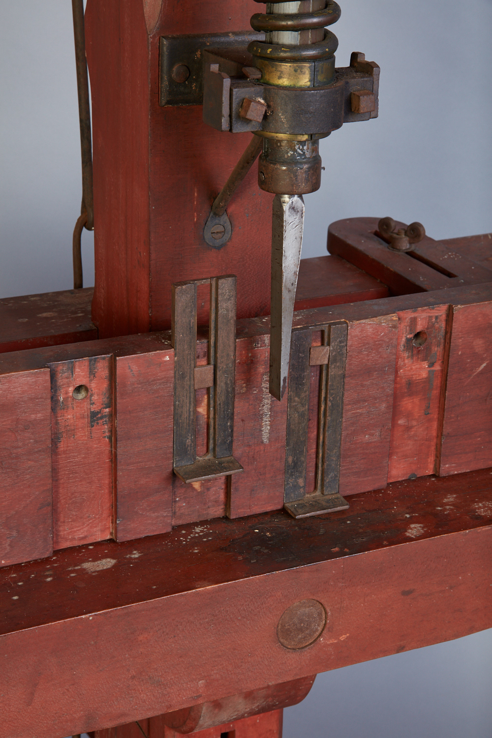 A machine is being used to make a piece of wood.