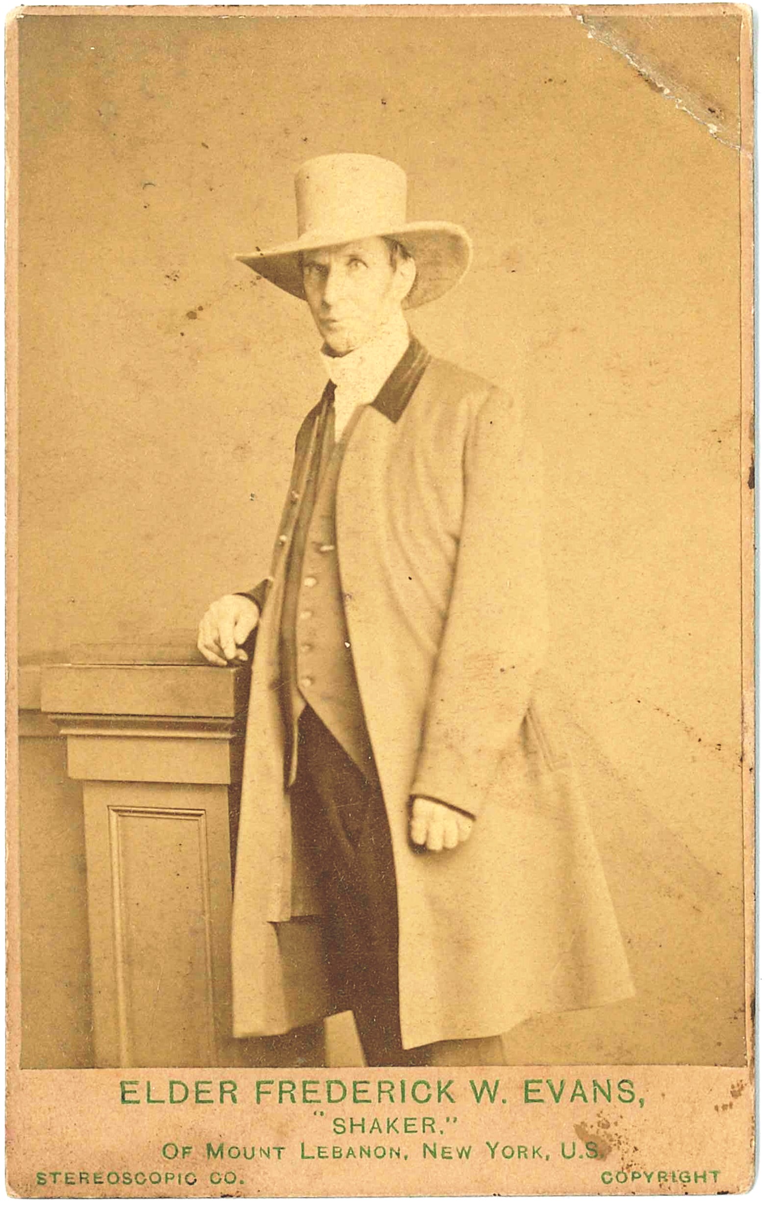 An old photograph of a man in a hat.