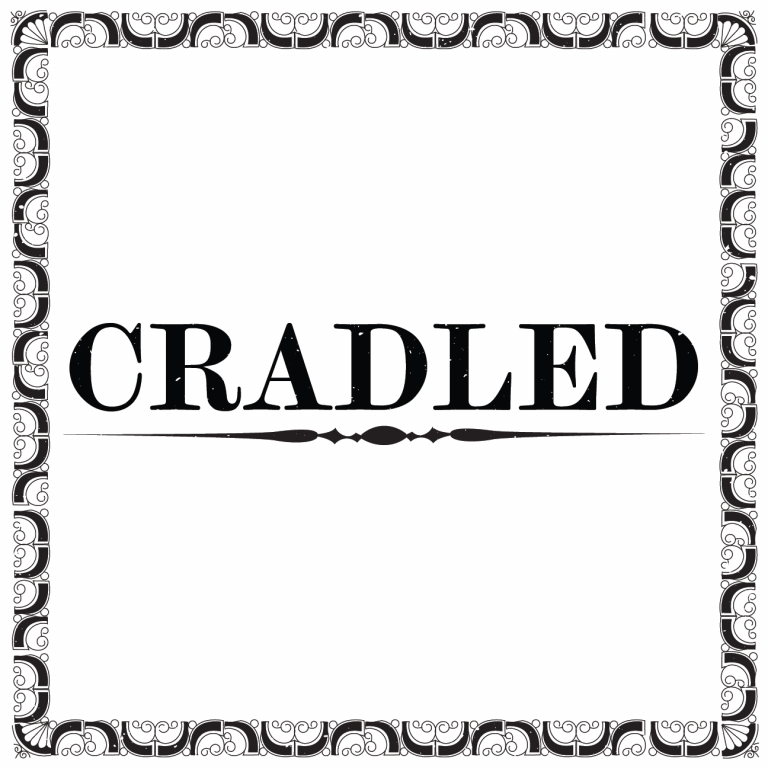 A decorative border frames the word "CRADLED" in bold, black capital letters, with an ornamental horizontal line beneath the text.